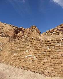 A color picture of a large sandstone masonry wall