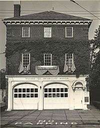 Facade of a three-story brick fire station