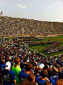 The Band of the Fighting Irish spells out ND through which the Notre Dame Fighting Irish Football Team runs onto the field.