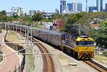 NR28 in Indian Pacific livery with the eastbound Indian Pacific at Mt Lawley, 2014.