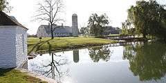 Nallin Farm Springhouse and Bank Barn