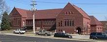 Brick building with pitched tile roof