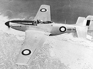 Overhead shot of single-engined fighter aircraft in flight