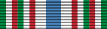 A ribbon 1/18 green, 1/18 white, 1/18 red, 1/18 green, 1/18 white, 1/18 red, 2/18 white, 2/18 blue, 2/18 white, 1/18 green, 1/18 white, 1/18 red,1/18 green, 1/18 white and 1/18 red.