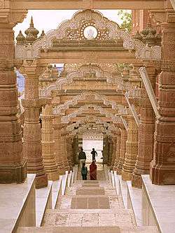 Long stone steps, with ornate tan arches