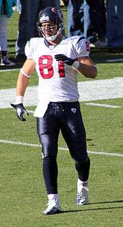  A football player walking on a football field