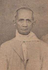 A sepia-toned photograph of an old man