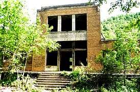 A two-story brick stone building