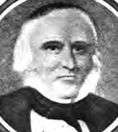 Formal portrait showing the head and shoulders of a white-haired man wearing a dark cape or coat