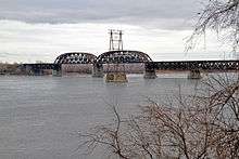 A bridge with two truss sections in the middle.