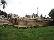 Temple complex with a lawn and a low hedge