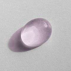 An oval cabochon of pink quartz