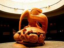 Bill Reid's 1980 sculpture Raven and The First Men. Raven crushing men under turtle shell