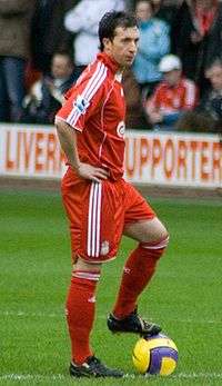 A man who plays football for Liverpool F.C., just before kick-off