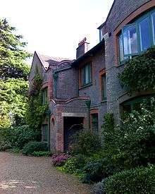 Outside of an old-style brick cottage