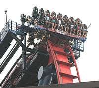 One of SheiKra's trains going over the drop