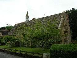 Building with arched window and small turret.