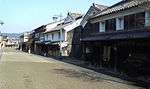 Wooden houses with white walls.