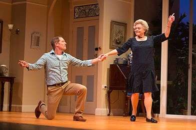 Todd McKenney (kneeling) and Nancye Hayes (standing) while dancing in a performance of the play Six Dance Lessons in Six Weeks