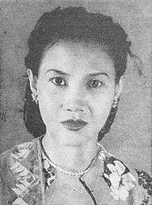 A black and white portrait of a woman.