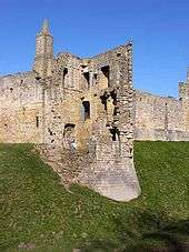 A half ruined tower, effectively showing a cross-section of the interior.