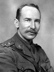 black and white portrait of a male in uniform