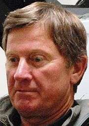 Head shot of a man with brown hair.