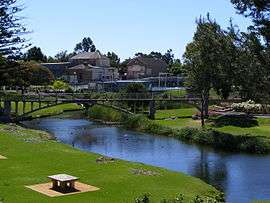 Angas River in a park with a footbridge