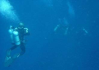 Technical divers at a midwater decompression stop