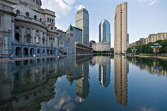 Reflecting pool with high-rises in the background