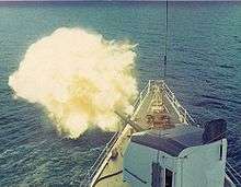 USCG Cook Inlet conducts fire support off the coast of Vietnam in 1971.