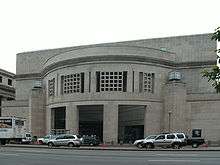 14th Street Entrance of USHMM. Large, rectangular façade with rounded opening.