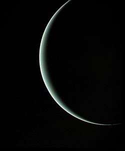 Departing image of crescent Uranus