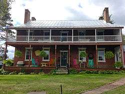 Rear of the house, with a porch on both floors