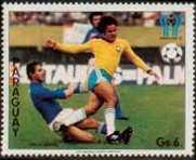 Brazilian footballer being tackled from behind by an Italian player