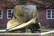 Upper jaw of a sperm whale that has been weathered and yellowed.