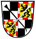 Quartered, first and third: Party per cross argent and sable; second and fourth: Or, a lion rampant sable, armed langued and crowned gules, bordured gyronny argent and gules; overall a Reuthaken sinister sable and a Reuthaken argent