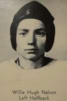 A man with a leather helmet and a white football jersey