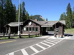 Log Northeast Entrance Station of Yellowstone National Park as one approaches by car.