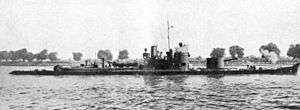 a black and white photograph of a boat on a river