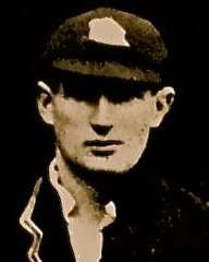 A headshot of a cricketer in a cap