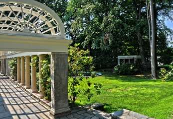 A pergola, fountain, and teahouse